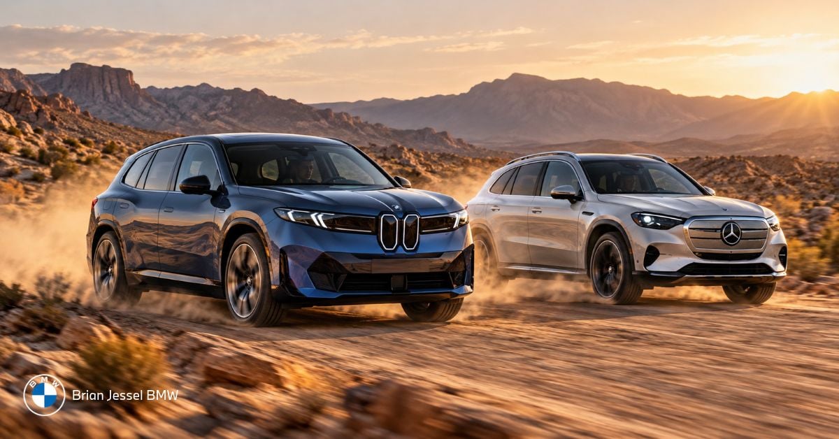 2027 BMW iX3 and Mercedes GLC EV driving through a dusty desert landscape at sunset.