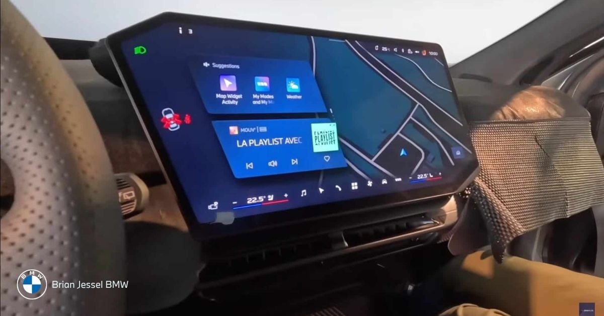 Modern BMW iDrive system interface with live map, playlist controls, and suggestion widgets