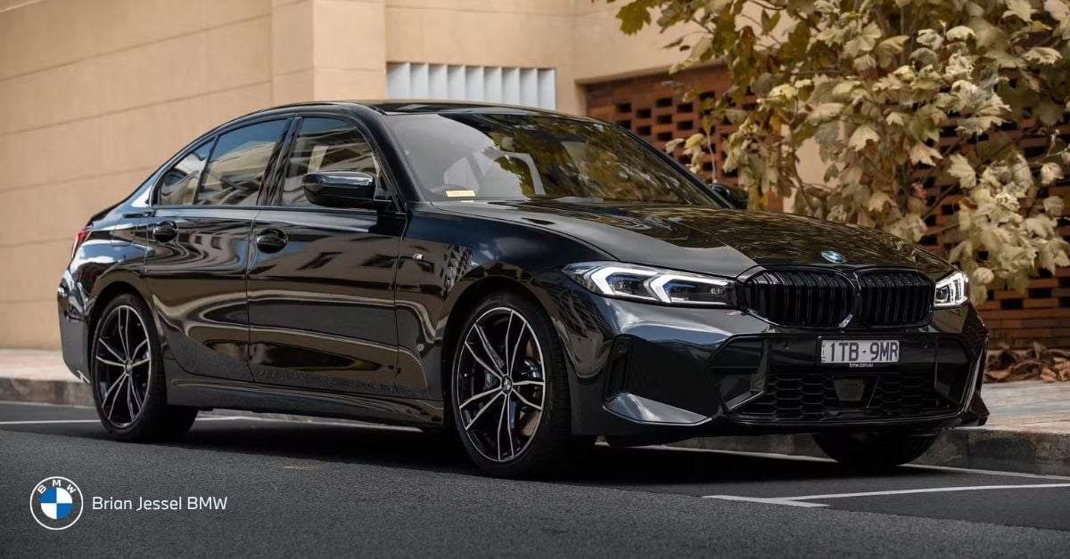 Elegant black BMW 3 Series parked on city street showcasing luxury design at Brian Jessel BMW