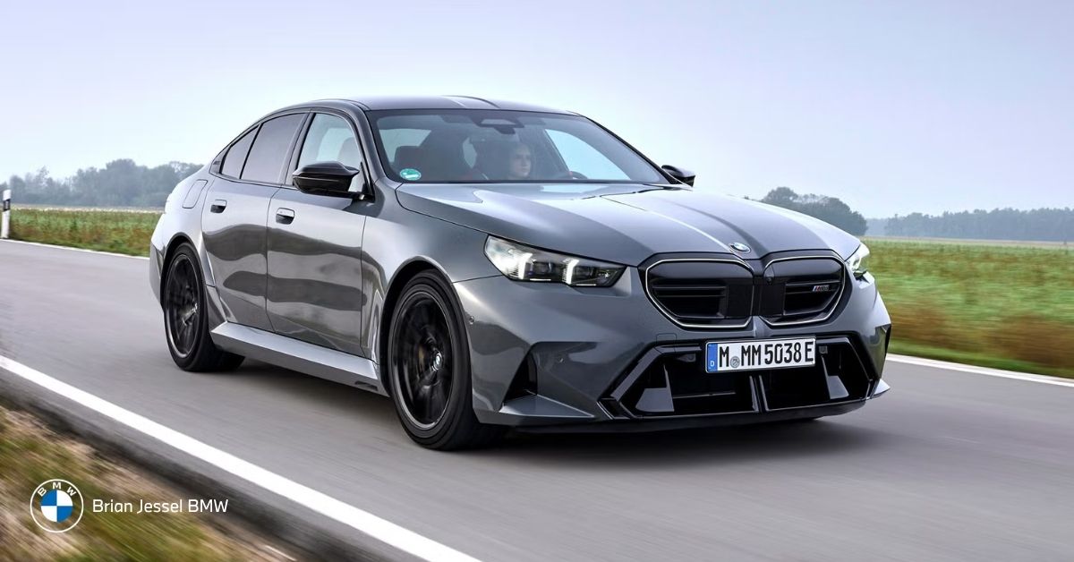 BMW 5 Series sedan driving on road, showing refined design and professional appearance suited for business and client-focused use