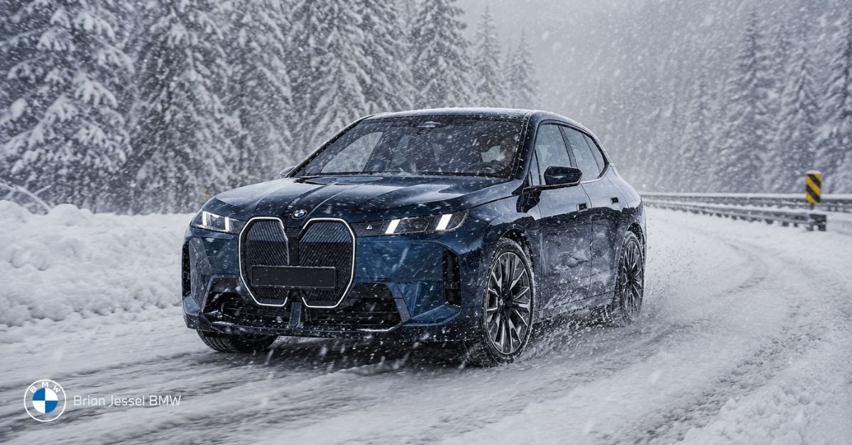 BMW iX driving through snowy BC roads, demonstrating winter EV range performance and cold-weather practicality near Vancouver.