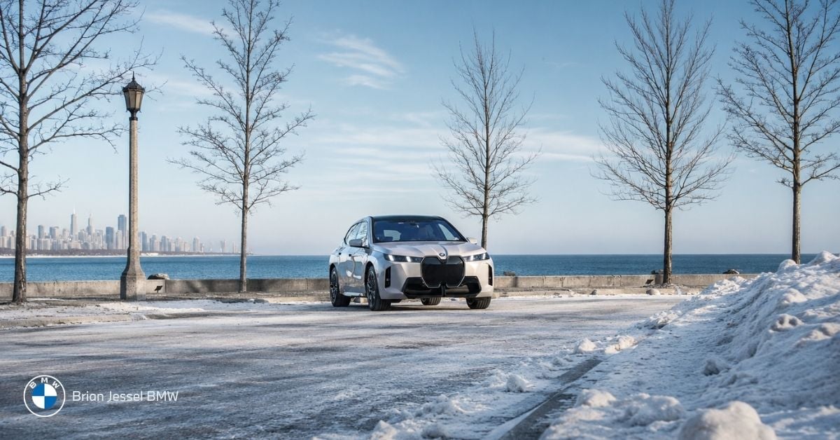 BMW iX driving beside Vancouver waterfront during winter, showcasing EV capability, traction, and cold-weather driving confidence in BC.