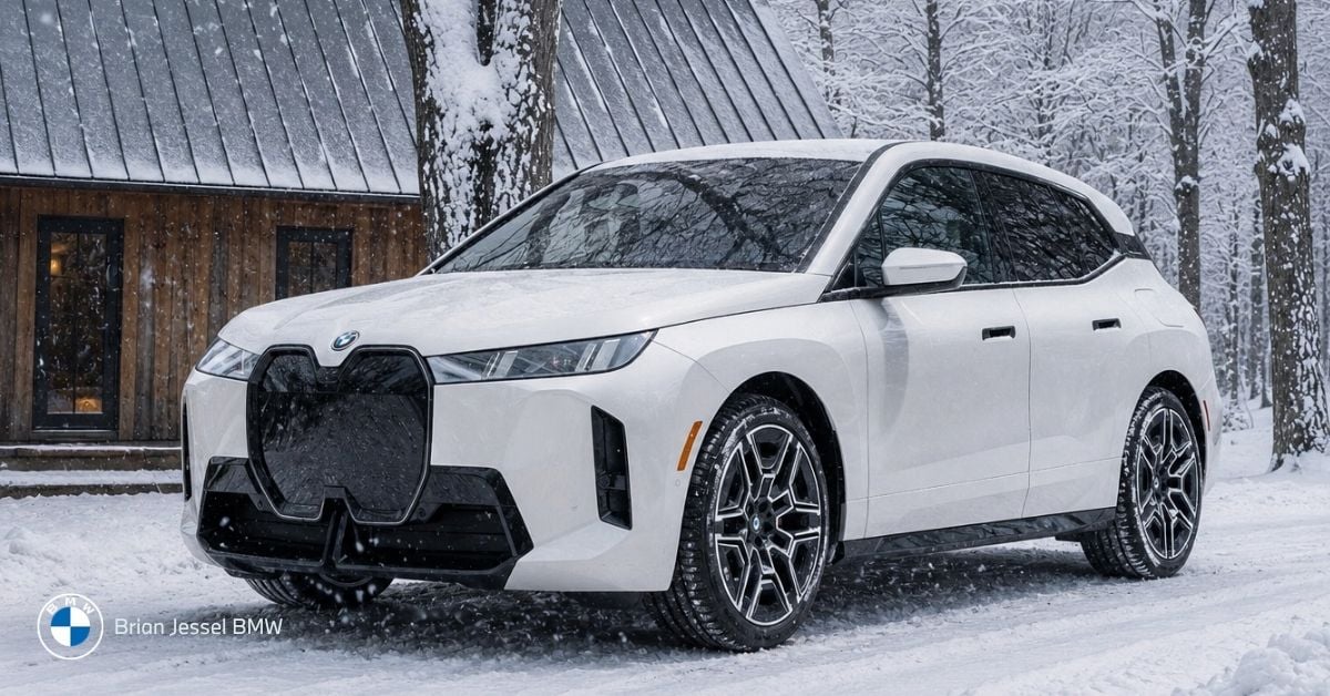BMW iX parked in snowy BC setting, highlighting winter EV range expectations and cold-weather electric driving performance.