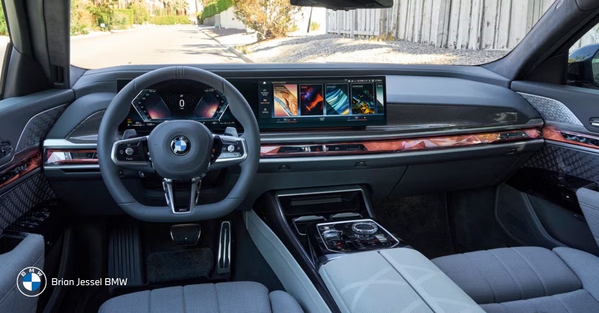 Opulent BMW 7 Series interior showcasing expansive curved display, premium Merino leather seats, and exquisite wood trim accents.