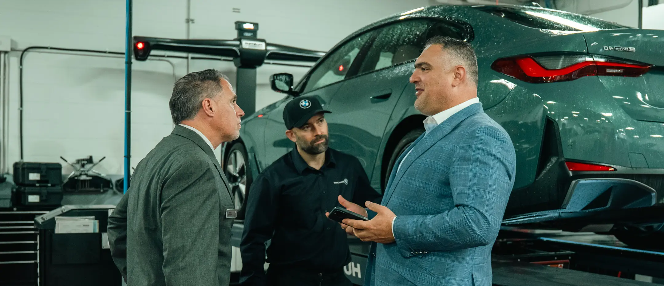 BMW service team consultation at Brian Jessel BMW