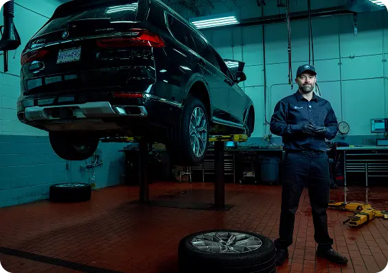 BMW SUV service technician in the maintenance facility