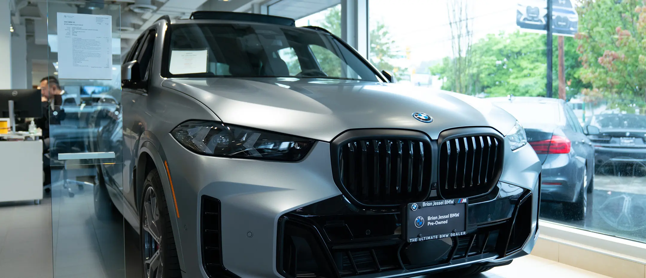 Silver BMW SUV in showroom