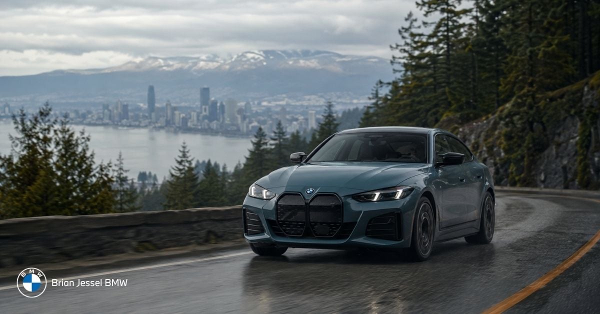 BMW i4 demonstrates regenerative braking on wet Vancouver mountain road during realistic Lower Mainland driving.