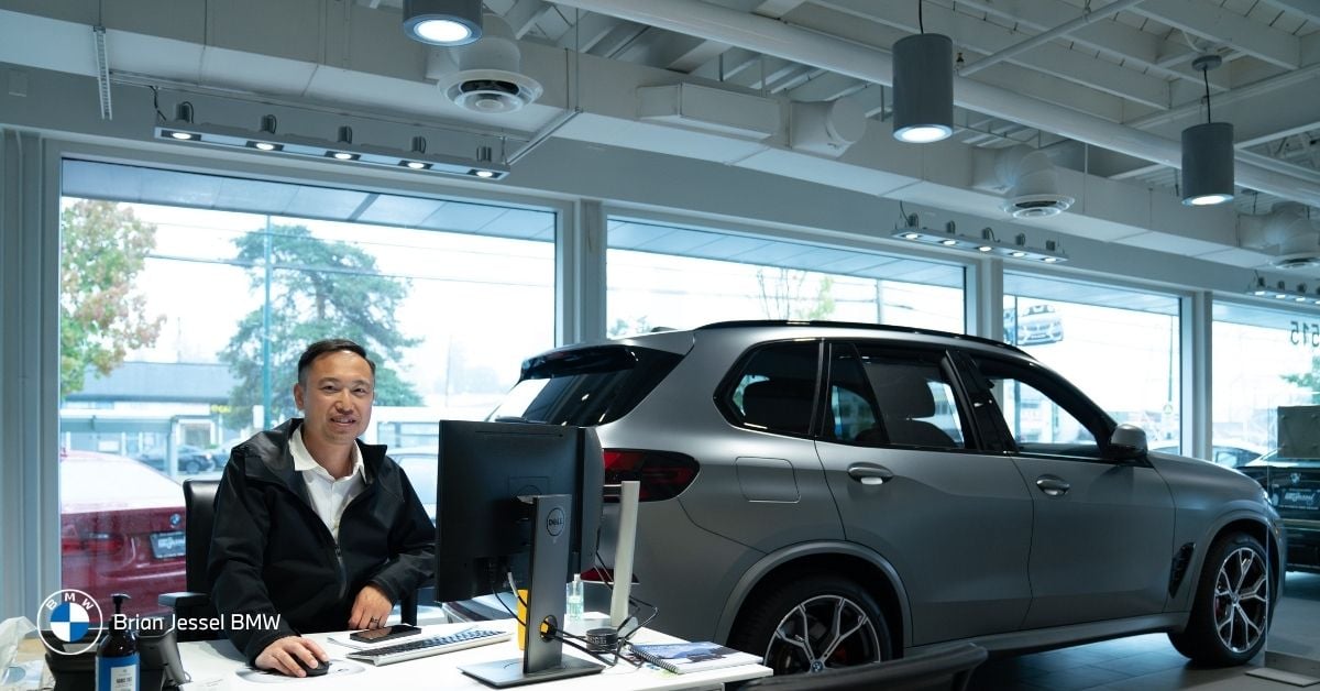 Brian Jessel BMW showroom in Vancouver displays multiple vehicles for owners seeking warranty and service support.