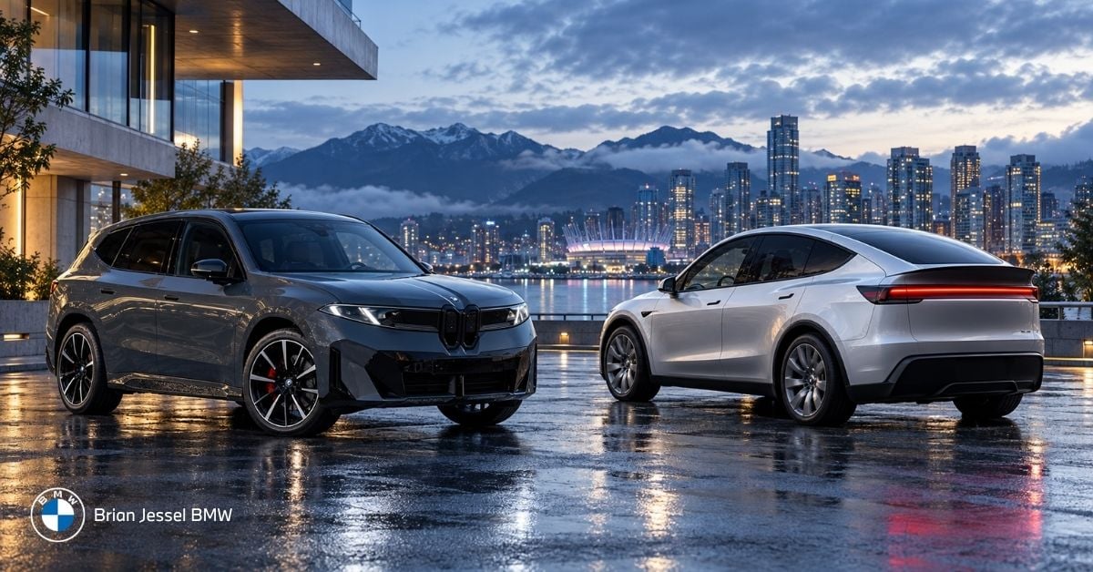 2027 BMW iX3 and Tesla Model Y parked overlooking Vancouver skyline and mountains at dusk.