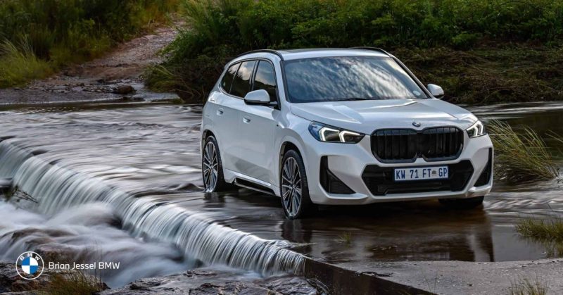 2025 BMW X1 driving through shallow water, showcasing capability and suitability for diverse Canadian lifestyles.