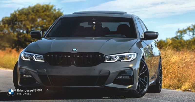 Front view of a sleek gray BMW 3 Series, showcasing its stylish design and features