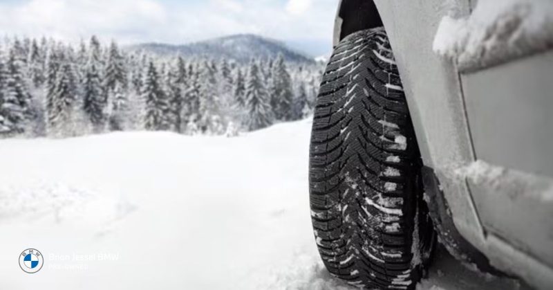 BMW EV tire in snow, showcasing winter readiness with strong traction in snowy Vancouver conditions