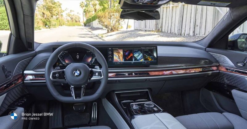 BMW curved display dashboard with iDrive 8.5 and AI-assisted controls interior