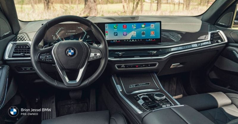 BMW X5 interior with a modern infotainment system, showcasing the dashboard and advanced features