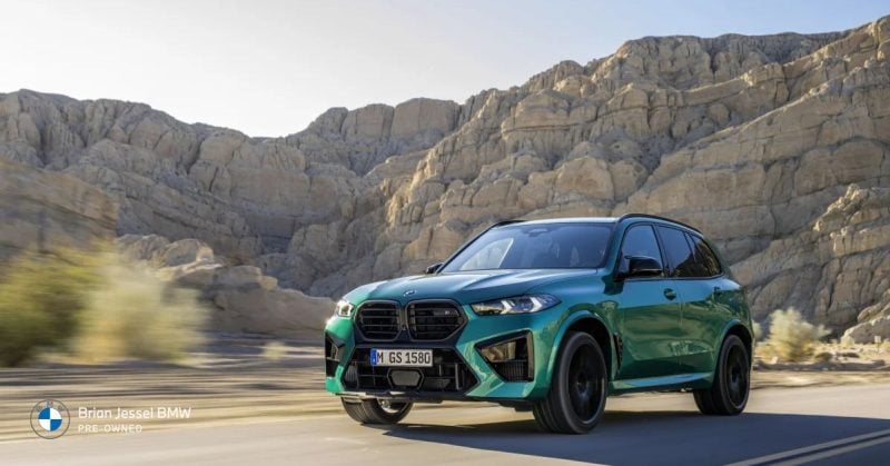 BMW X5 driving through rugged terrain with a modern design, showcasing durability and performance reliability