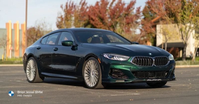 2022 BMW Alpina B8 Gran Coupe green luxury sedan parked outdoors, highlighting refined design, comfort-focused performance, and premium styling