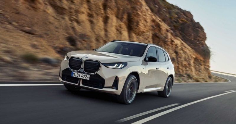 Beige BMW X3 family SUV in motion on curvy mountain road, showcasing sporty design and everyday practicality