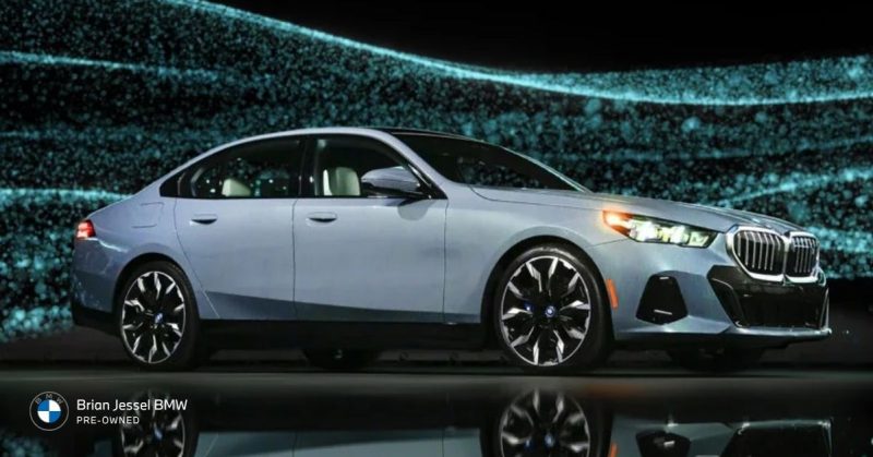 2024 BMW i5 M60 xDrive electric sedan displayed in studio, highlighting sleek design, performance focus, and advanced technology features