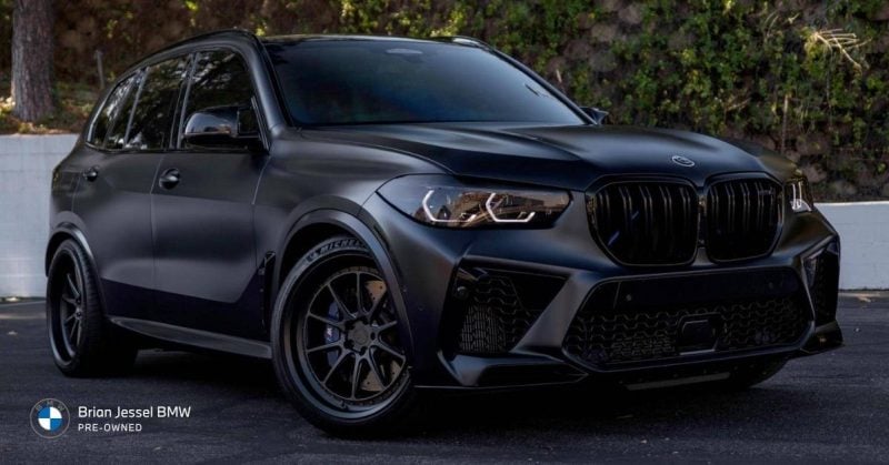 Matte black BMW SUV 2022 X5 parked outdoors, representing higher-mileage luxury vehicles, long-term ownership value, and maintenance considerations.