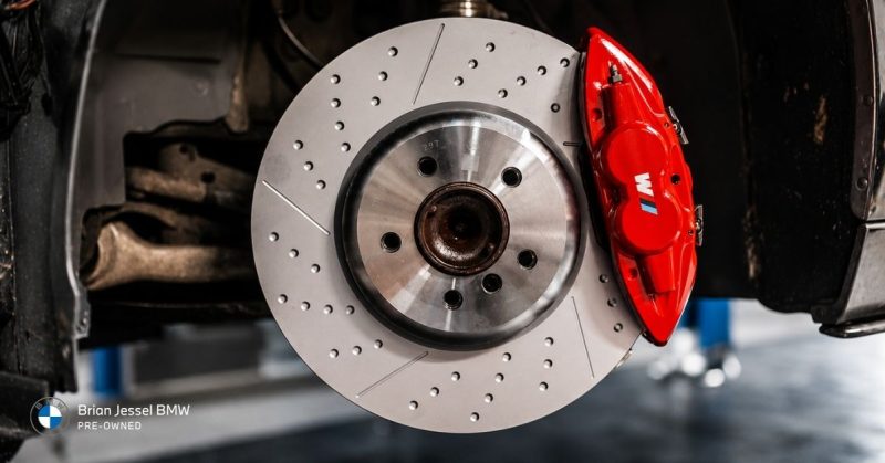 BMW performance brake rotor and caliper assembly illustrating brake lifespan, wear patterns, maintenance intervals, and stopping performance durability.