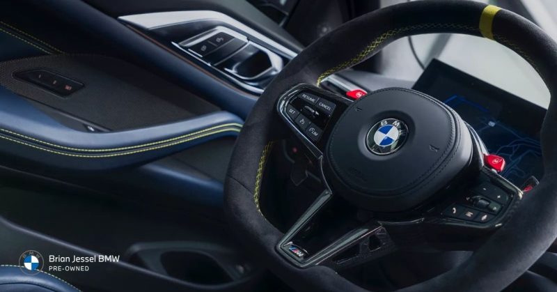 BMW interior comparison showing newer digital displays and iDrive technology versus slightly older but still capable pre-owned features
