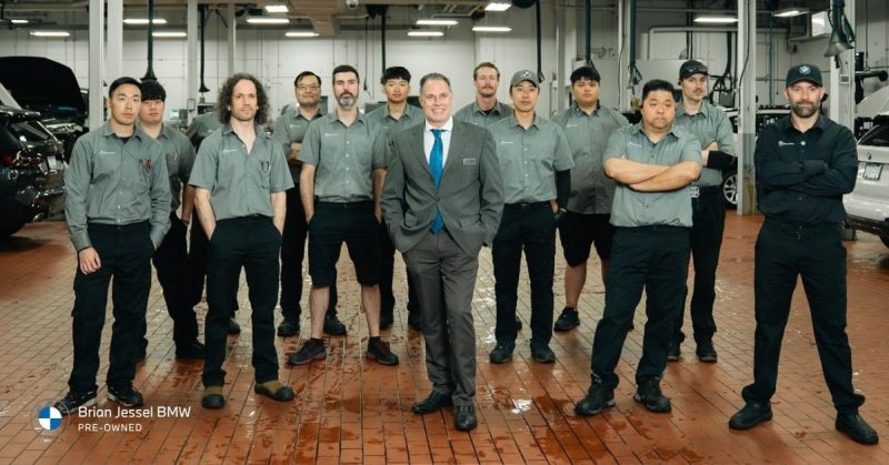 Brian Jessel Pre-Owned BMW team standing in service centre, showcasing expertise, certified vehicles, and trusted pre-owned support
