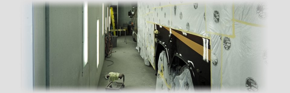 Covered up RV inside the bodyshop