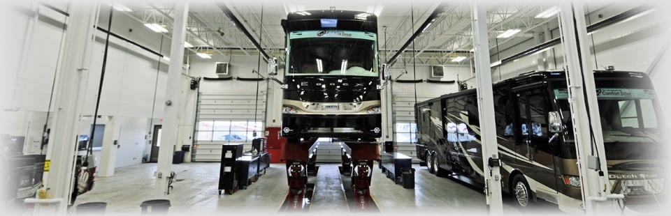  Raised RV inside the service shop